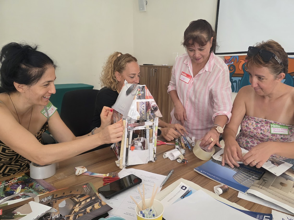 Participants building a tower together during the workshop