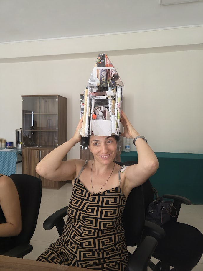 Participant playfully wearing the paper construction