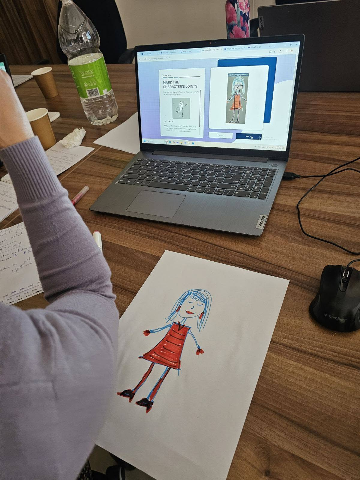 Hands-on digital creativity workshop with drawing and laptop-based activity
