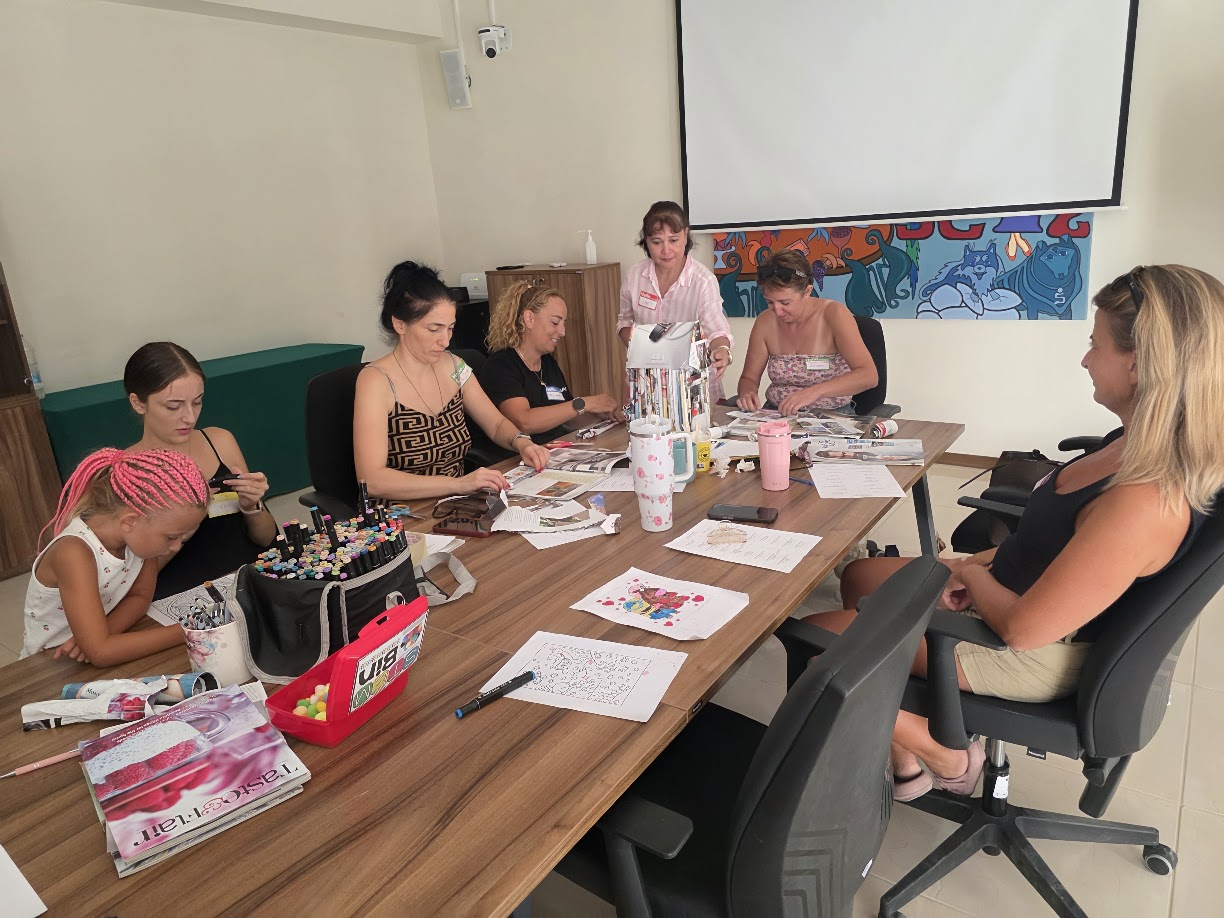 Workshop group working around a table at Genista Research Foundation