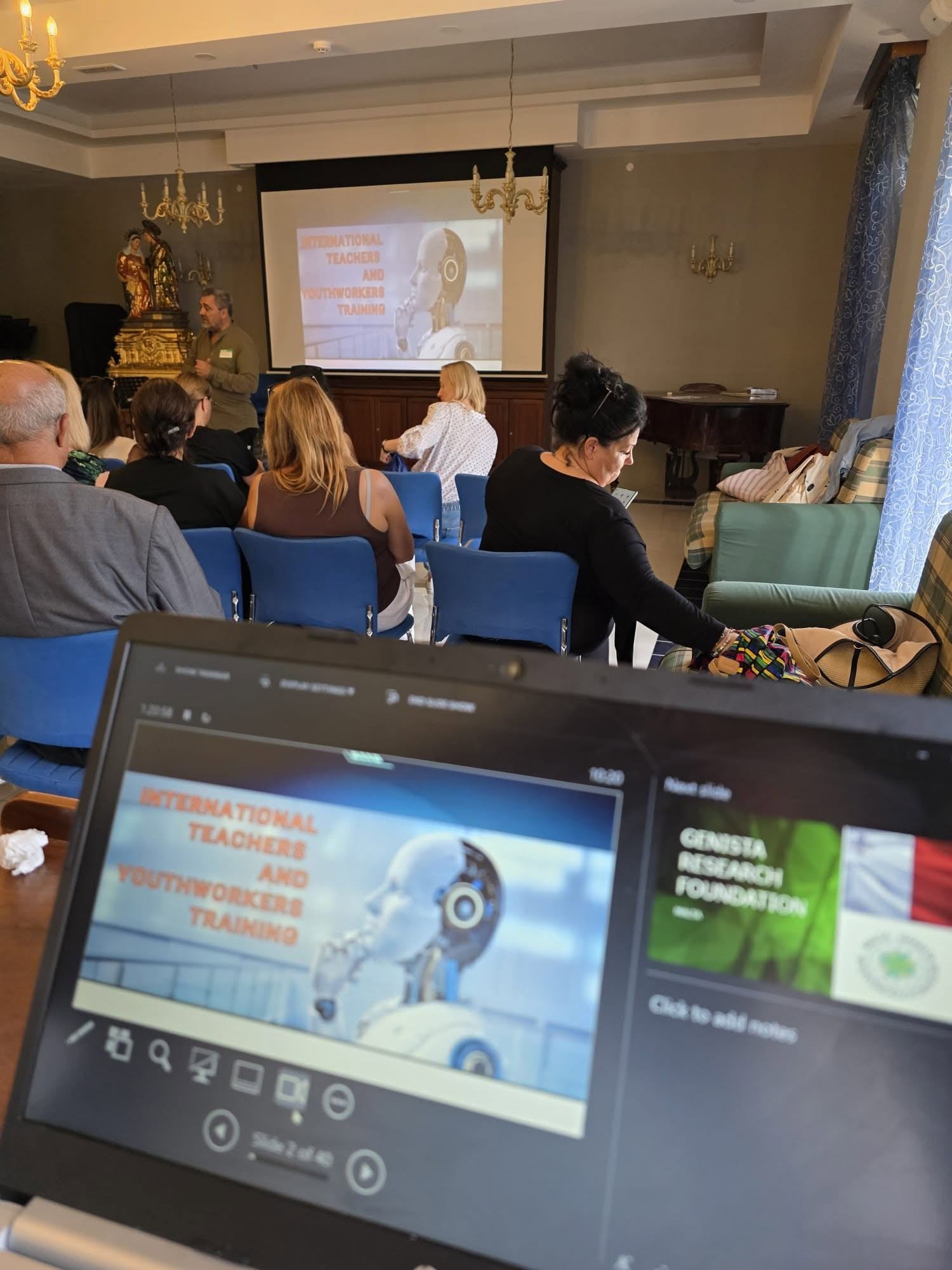 Trainer speaking during an international teachers and youth workers training session in Gozo